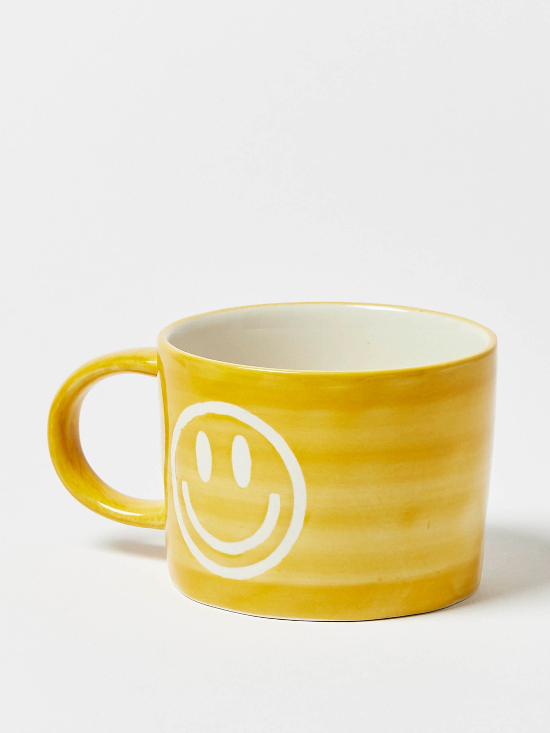 Smiley face yellow ceramic mug