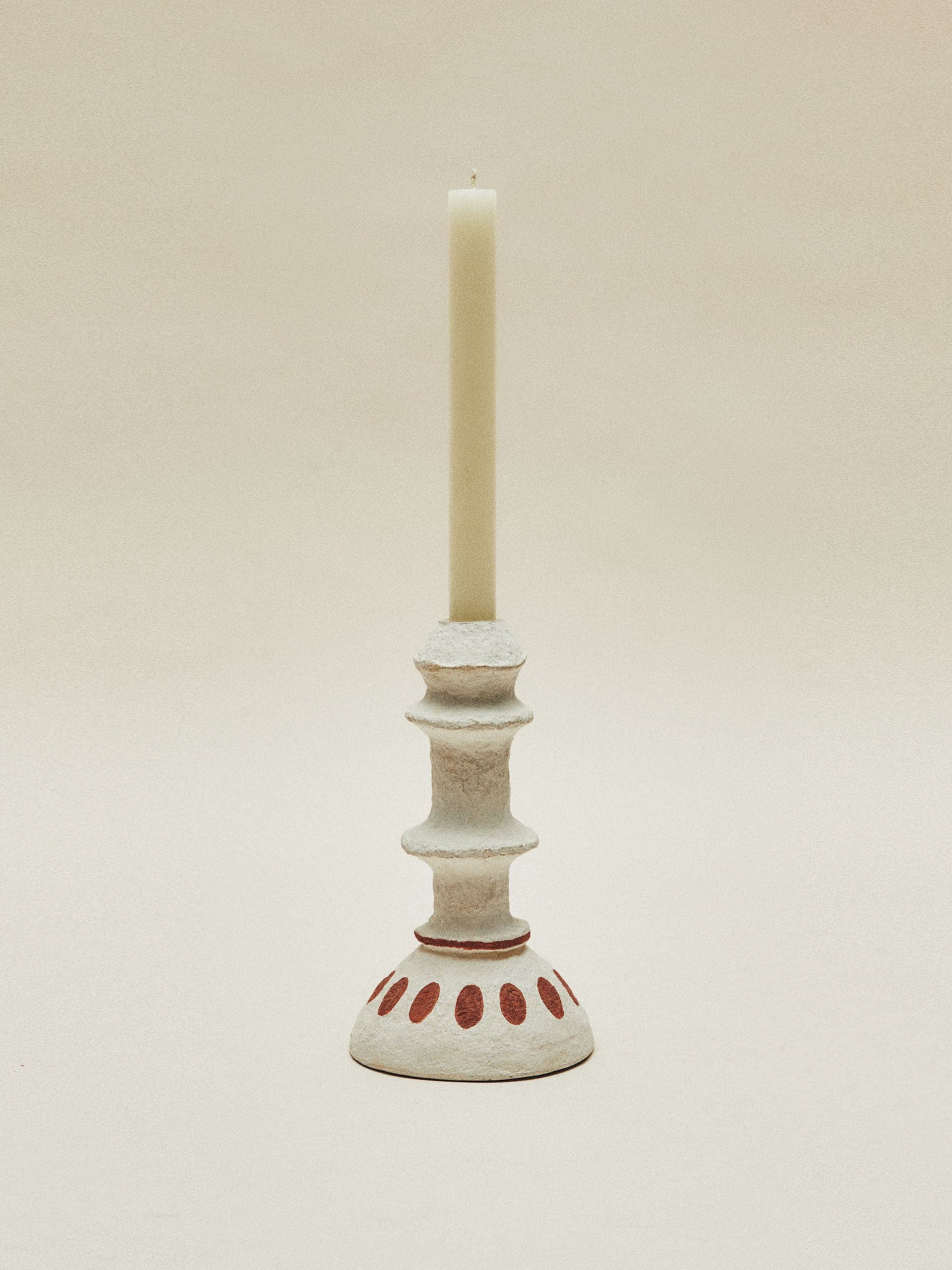 Curvy papier-mâché candlestick