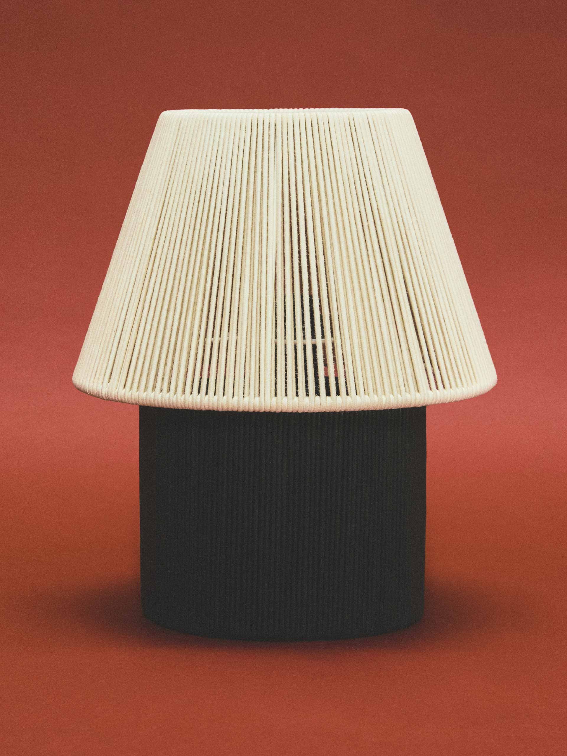 Table lamp with cord shade