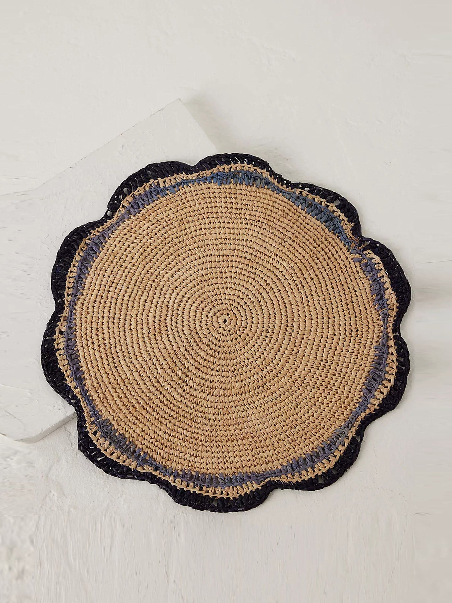 Woven raffia round placemat