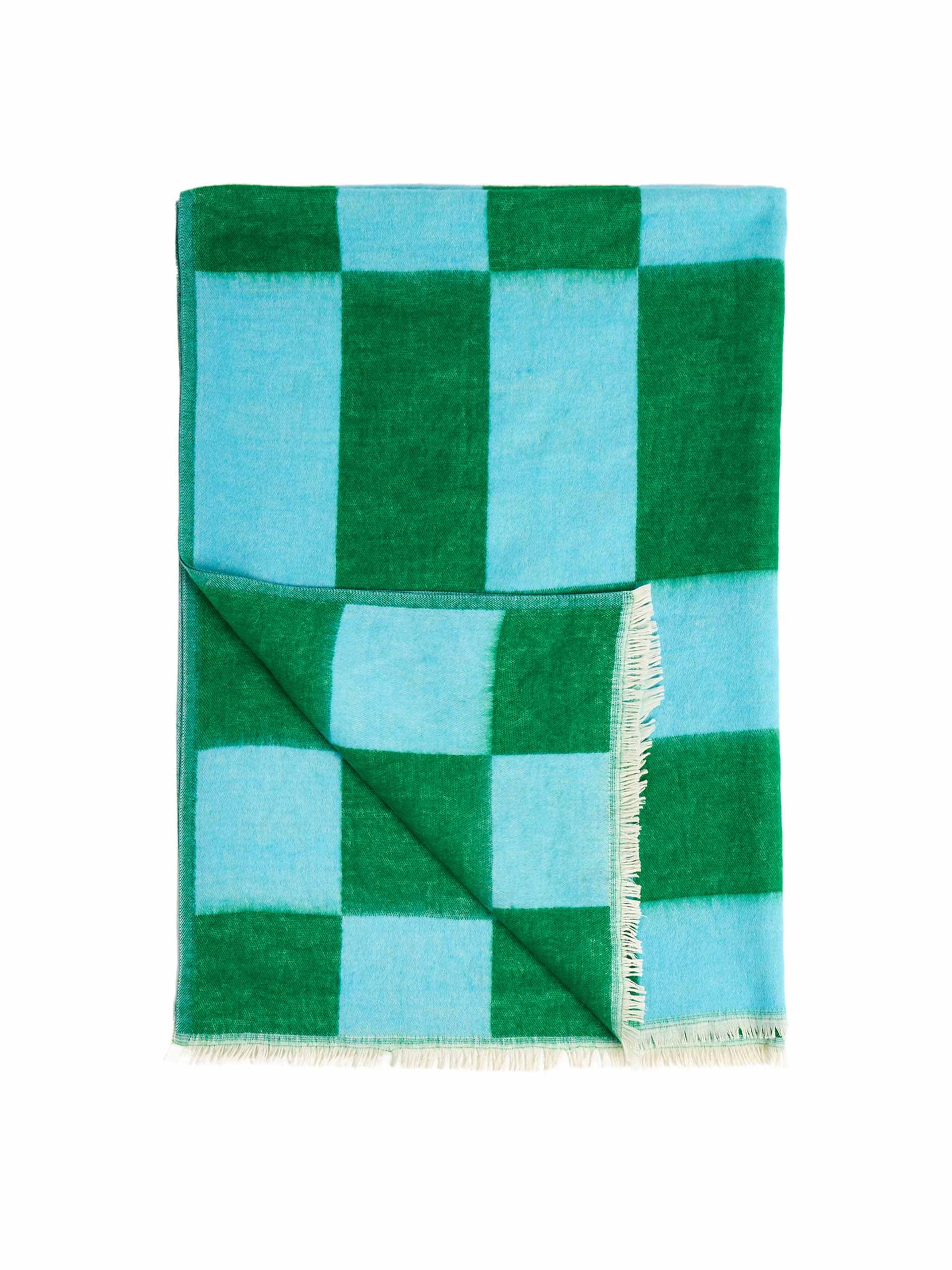 Blue and green chequerboard jacquard throw