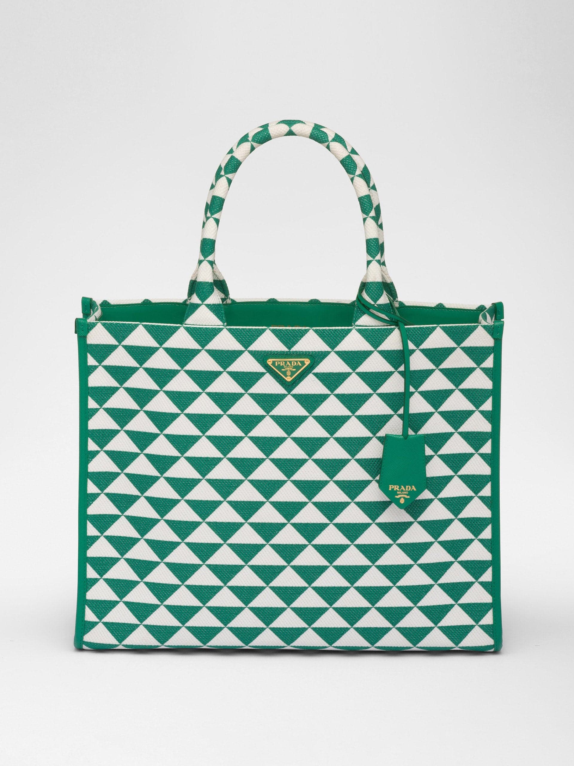 Green and white embroidered fabric handbag